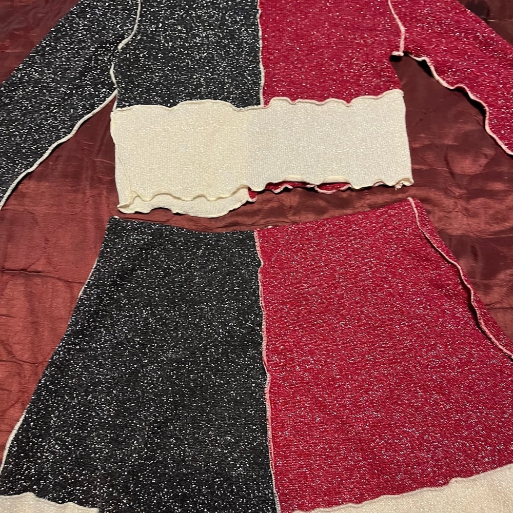 Crop top with matching mini skirt. Size medium.